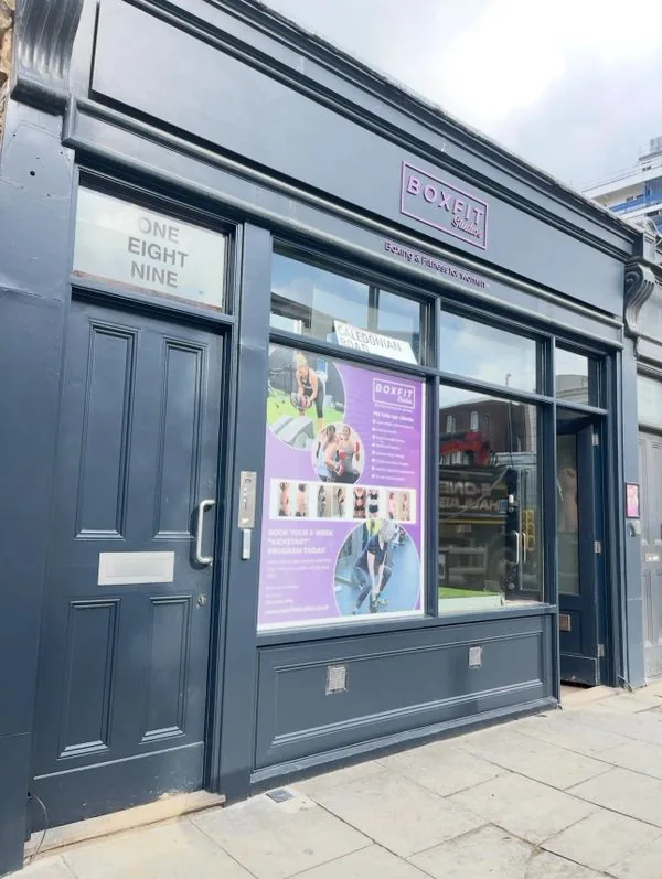 Completed commercial shopfront refurbishment in navy blue, London